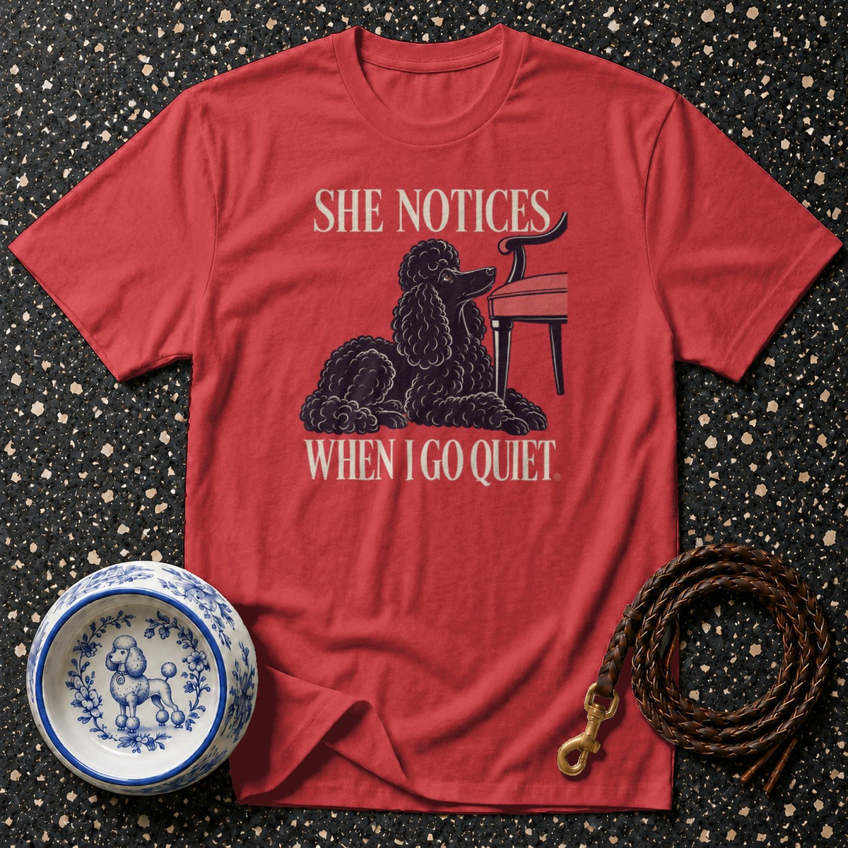 Red t-shirt with black poodle graphic and text "SHE NOTICES WHEN I GO QUIET".
