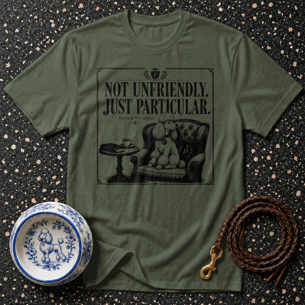Green t-shirt with "NOT UNFRIENDLY. JUST PARTICULAR." and poodle on armchair graphic.