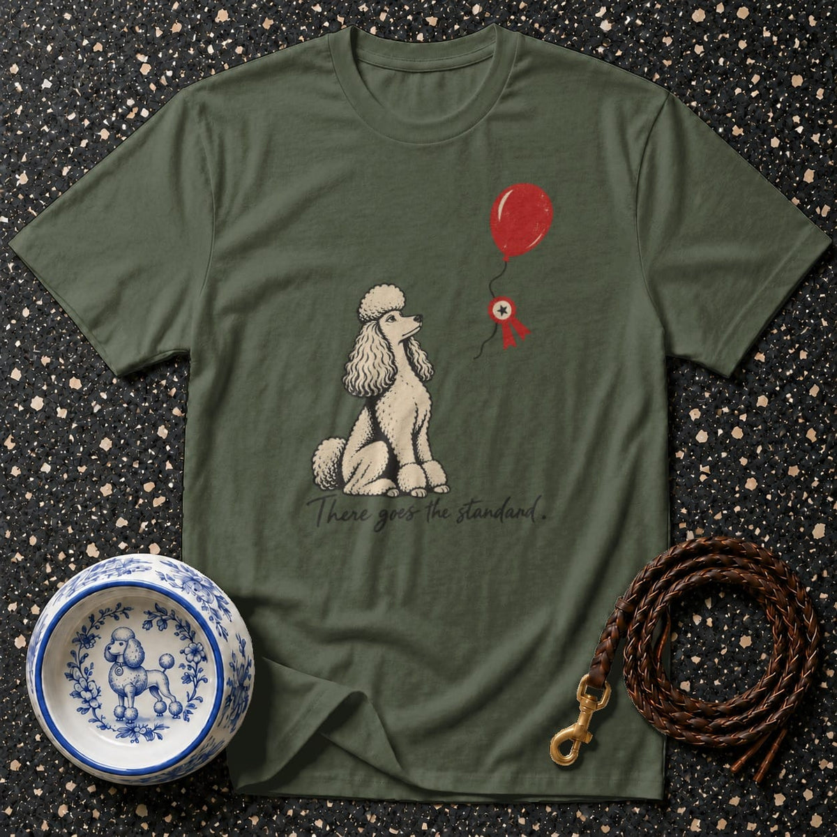 Olive green t-shirt with poodle, balloon, and text "There goes the standard".