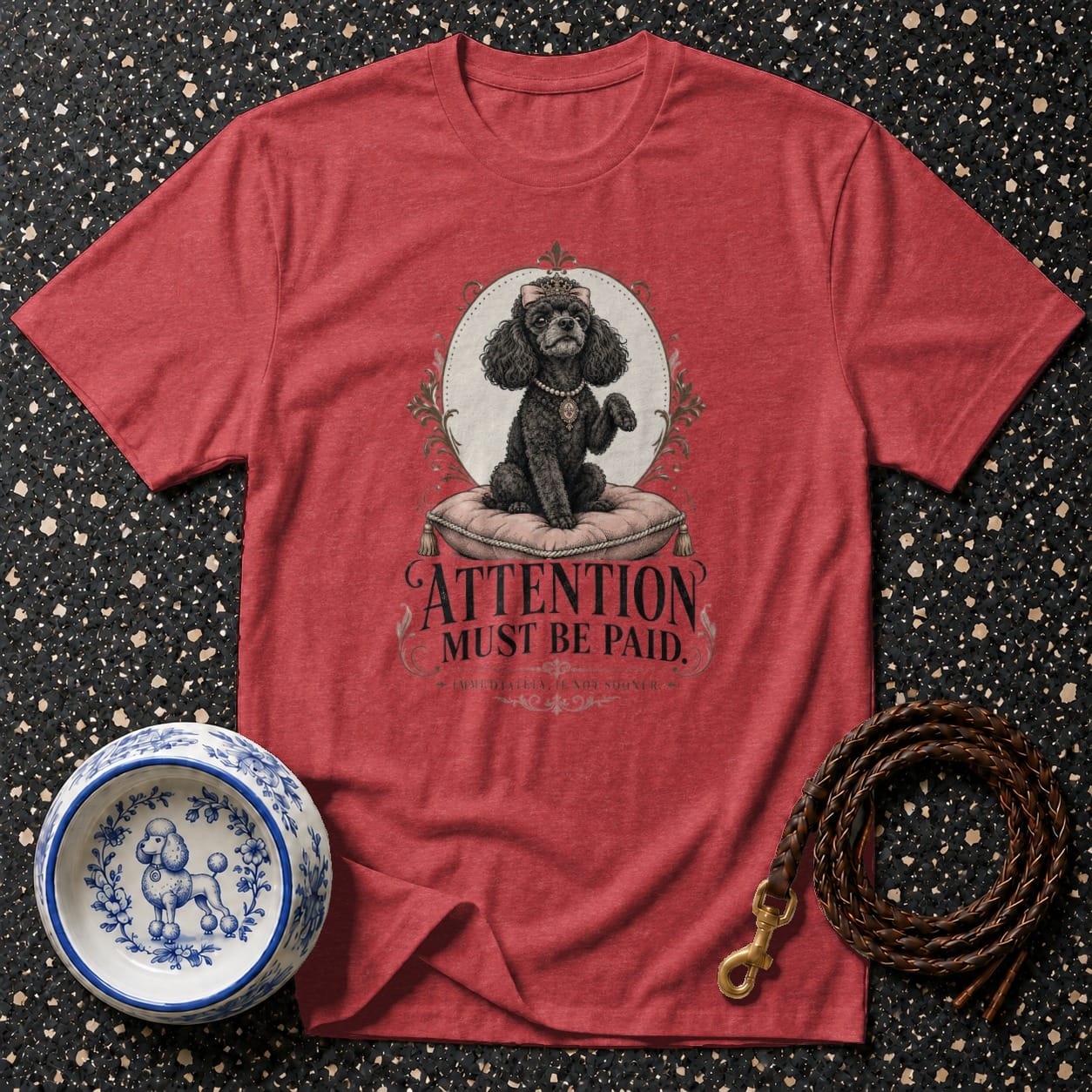 Red t-shirt with a black poodle wearing a crown and pearls, text: Attention Must Be Paid.
