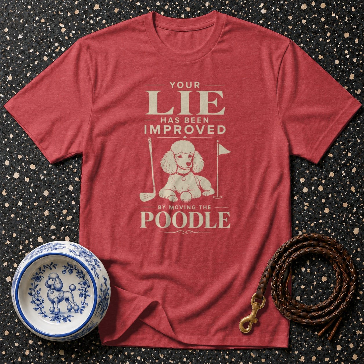 Red t-shirt with "Your Lie Has Been Improved By Moving The Poodle" graphic.