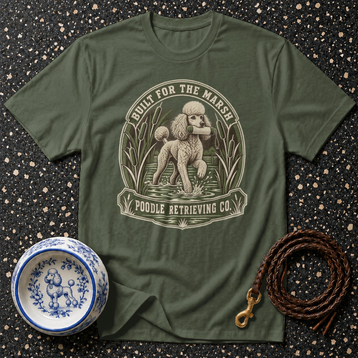 Olive t-shirt with a poodle retrieving in water, "Built for the Marsh" and "Poodle Retrieving Co." text.