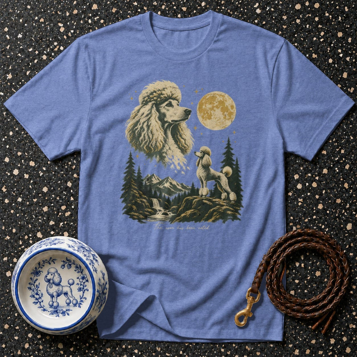 Blue t-shirt with vintage poodle graphic and mountain moon scene.
