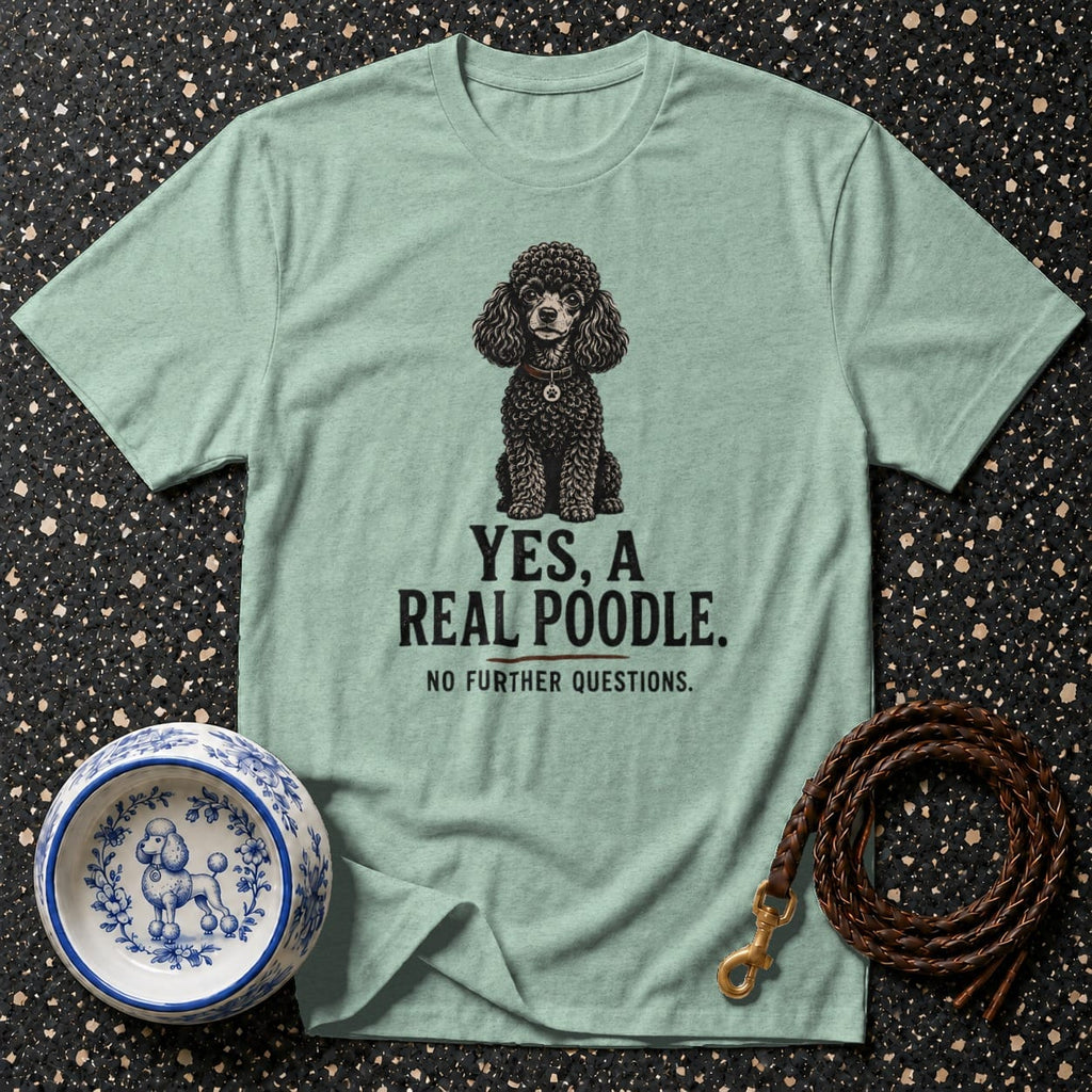 Light green t-shirt with a black poodle illustration and text reading "YES, A REAL POODLE."