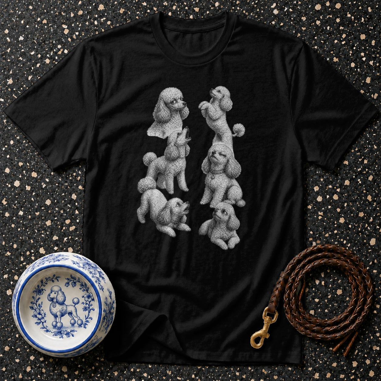 Black t-shirt with a detailed sketch of six poodles in various poses.