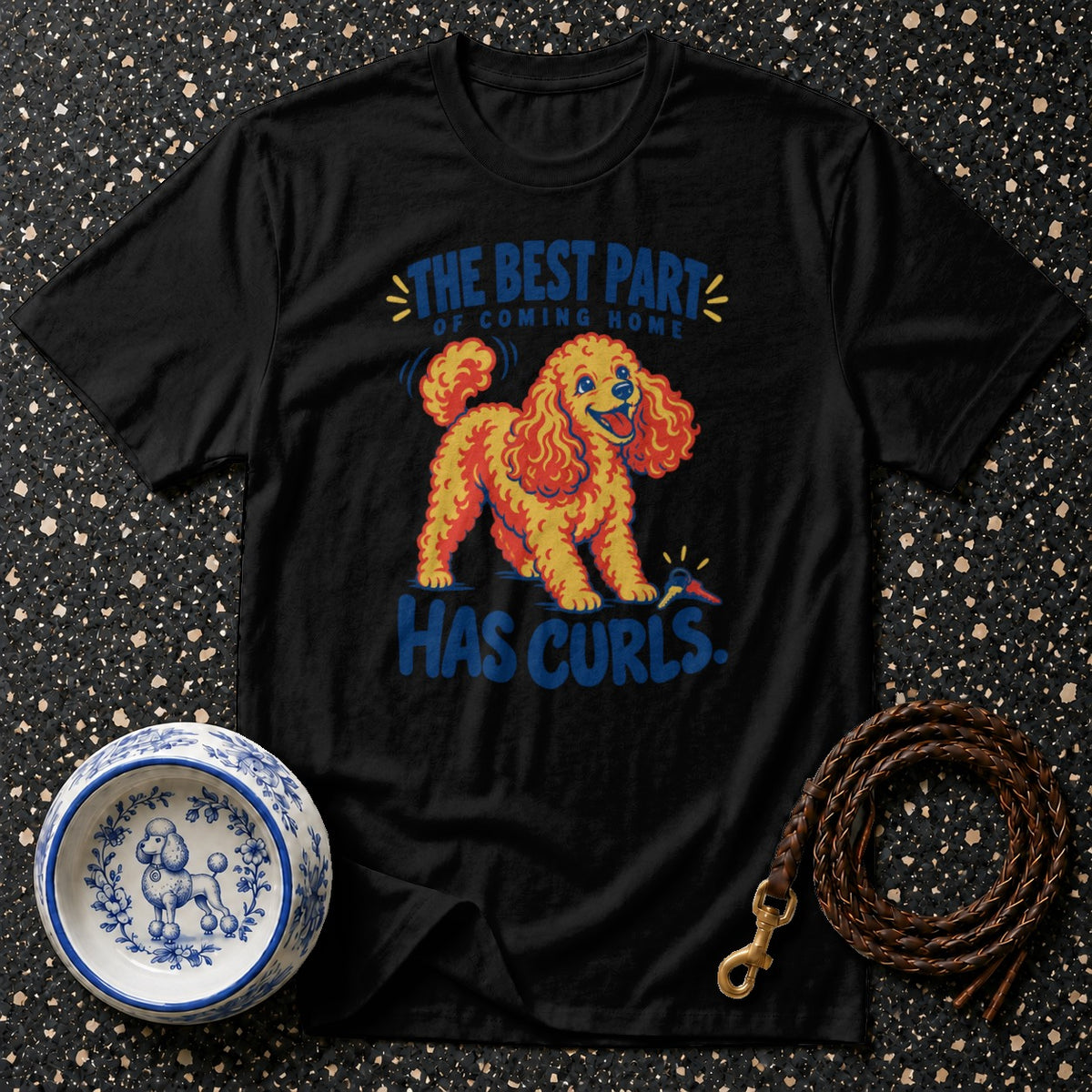 Black t-shirt with a poodle graphic and the text "The Best Part of Coming Home Has Curls."