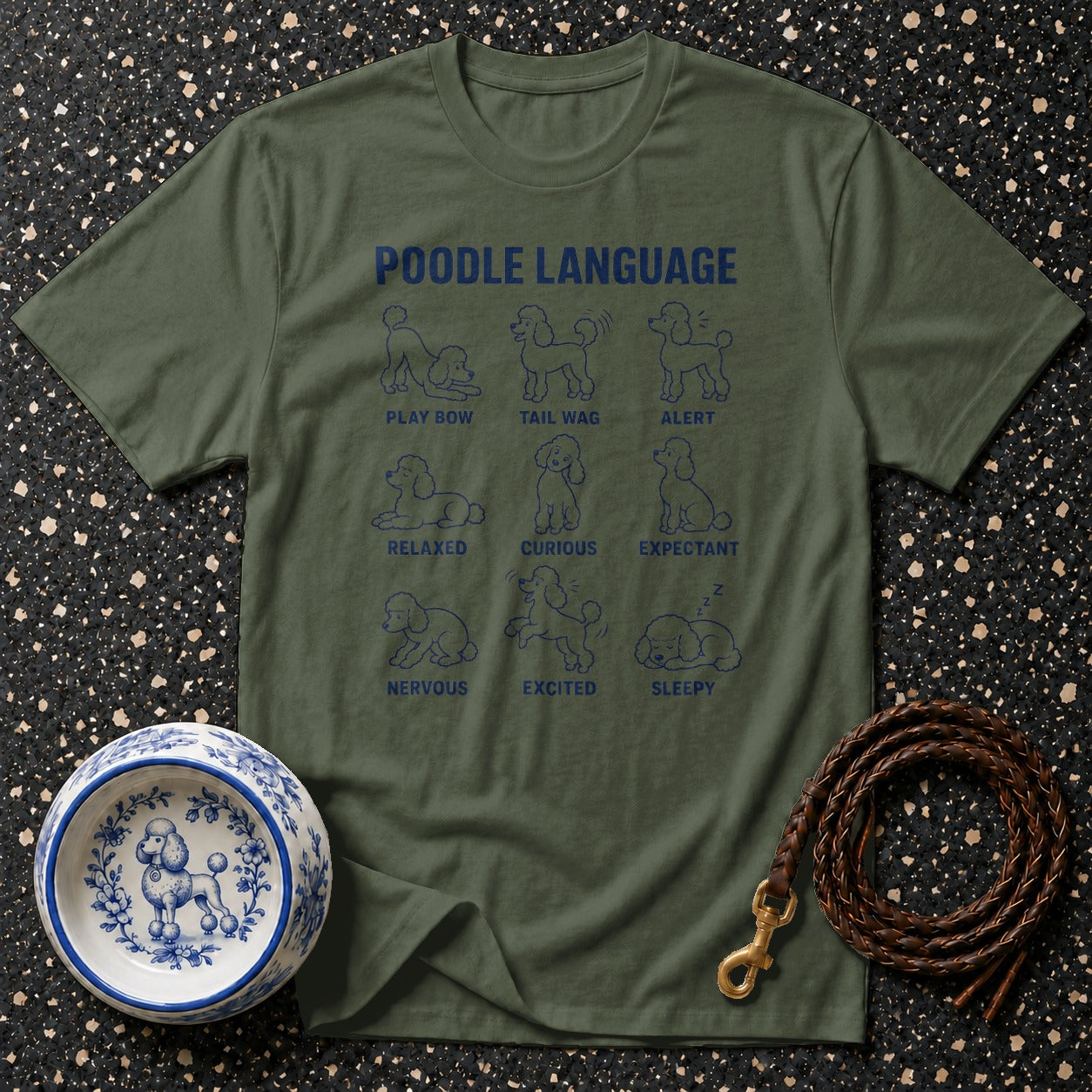 Olive green t-shirt with "Poodle Language" graphic showing nine poodle poses and descriptions.