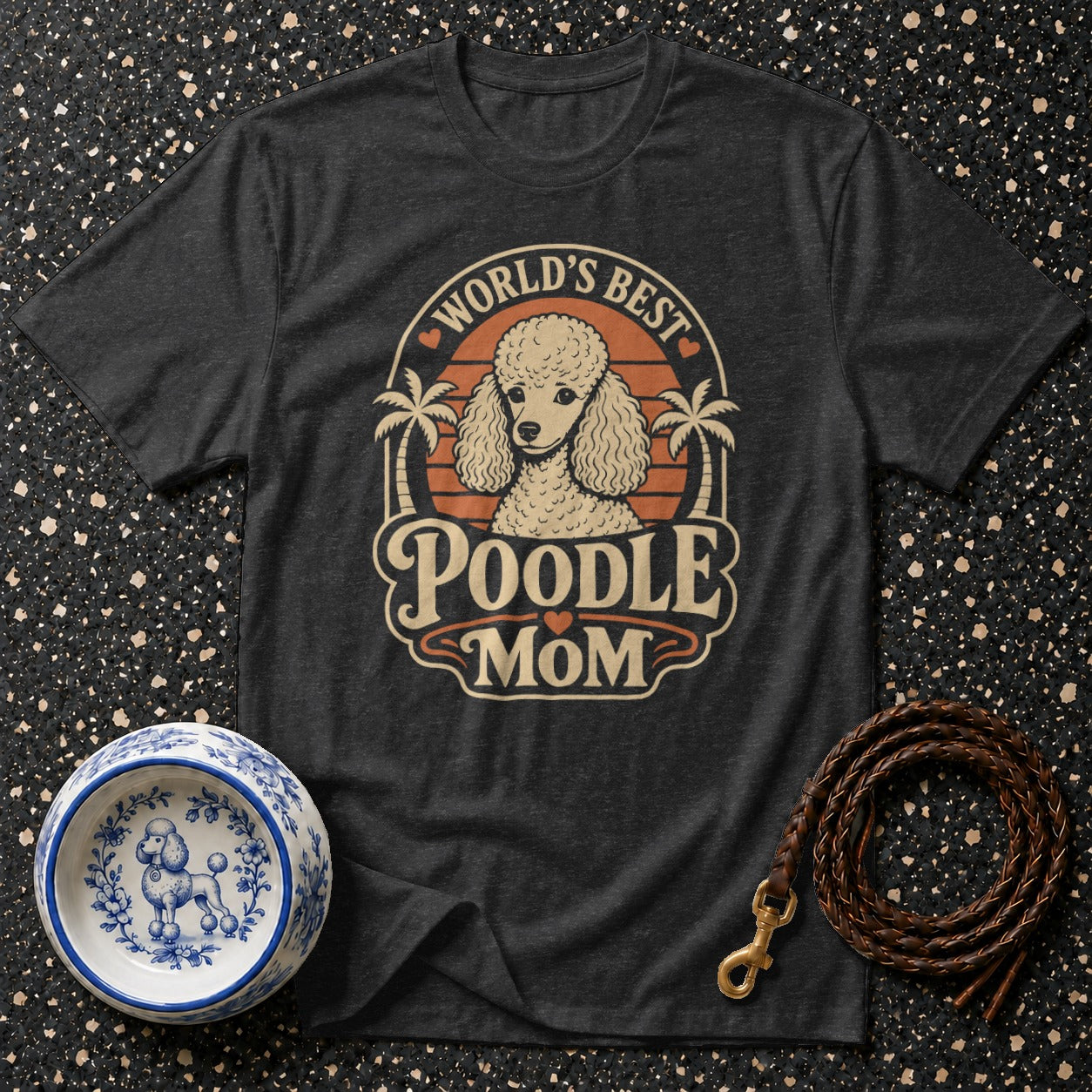 Dark t-shirt with "World's Best Poodle Mom" graphic and poodle illustration.