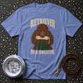 Blue t-shirt with a brown poodle graphic wearing a green sweater and holding a chew toy.
