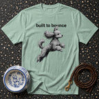 Light green t-shirt with black text "built to bounce" and a poodle graphic.