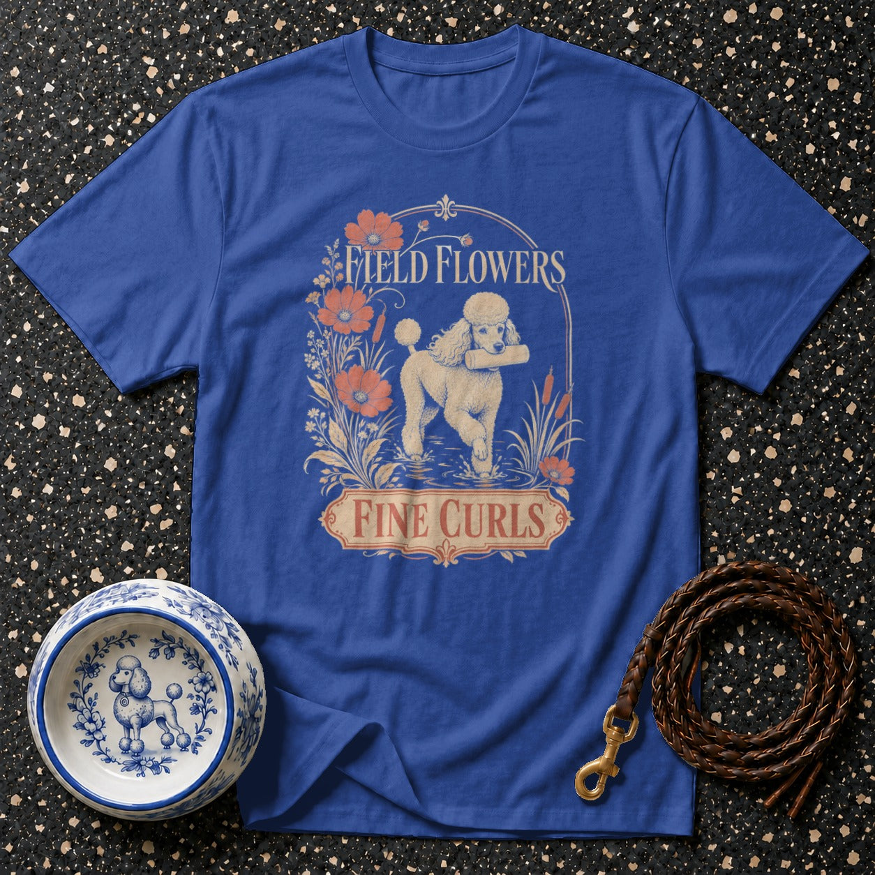 Blue t-shirt with "Field Flowers Fine Curls" text and a poodle graphic.