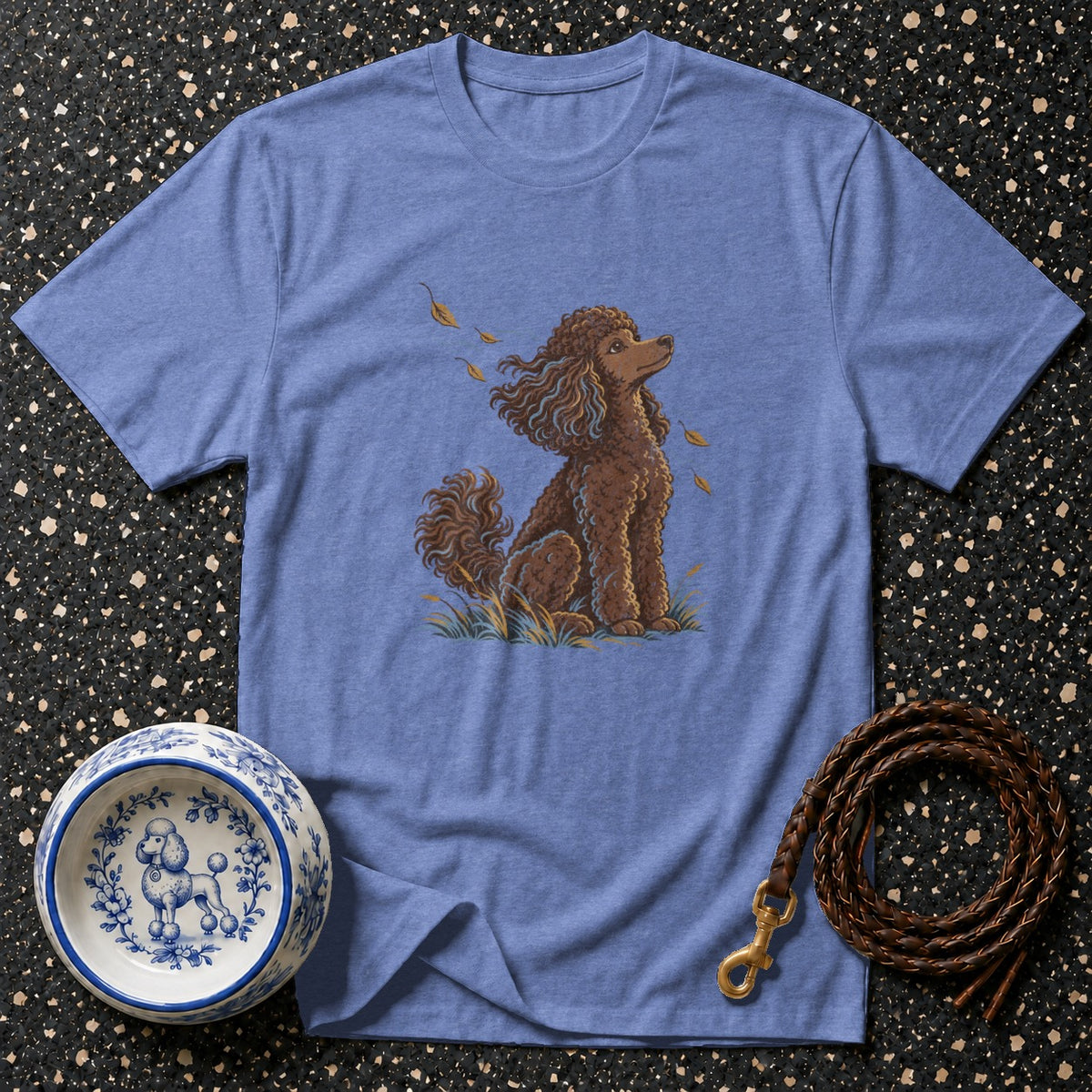Brown poodle design on a blue t-shirt with dog bowl and leash.