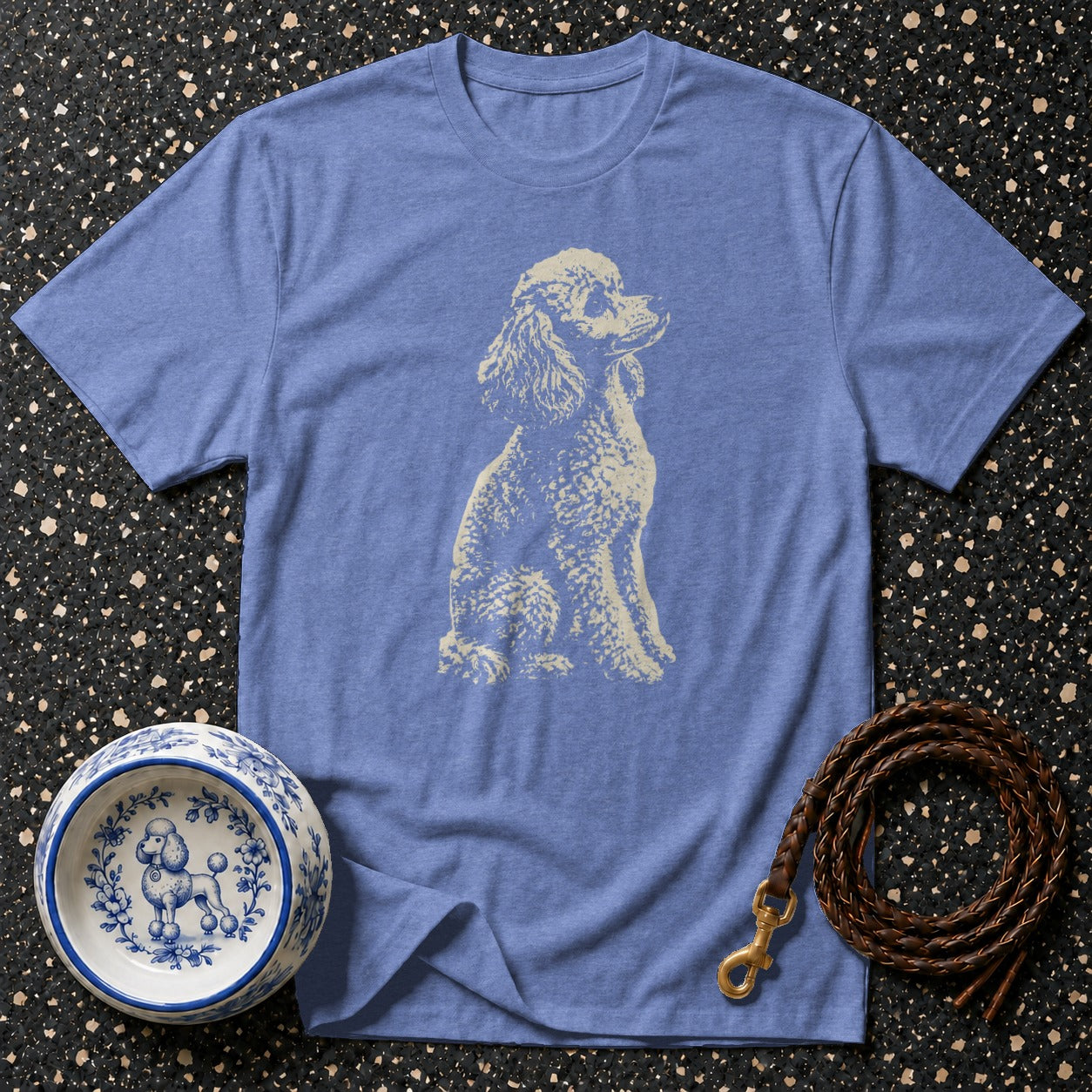 Blue t-shirt with a cream poodle graphic, dog bowl, and leather leash.
