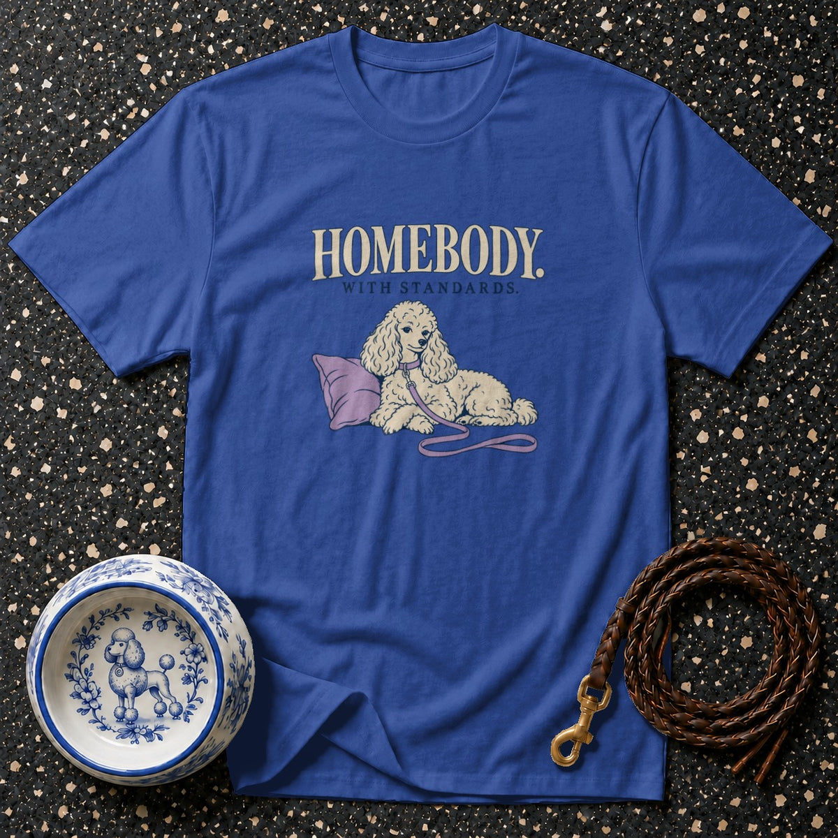 Blue t-shirt with "HOMEBODY WITH STANDARDS" text and poodle illustration.