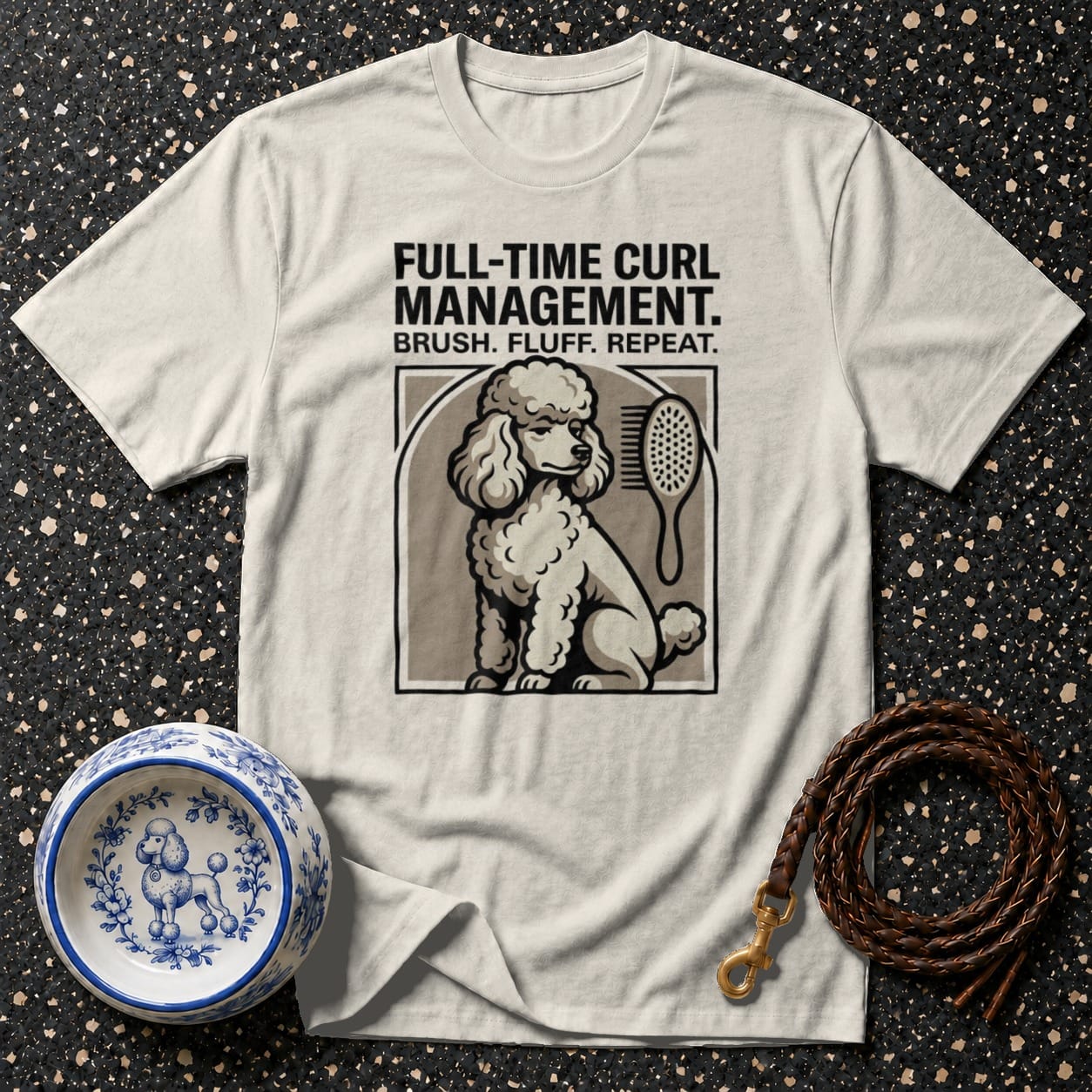 Cream t-shirt with poodle graphic and text "Full-time Curl Management. Brush. Fluff. Repeat."