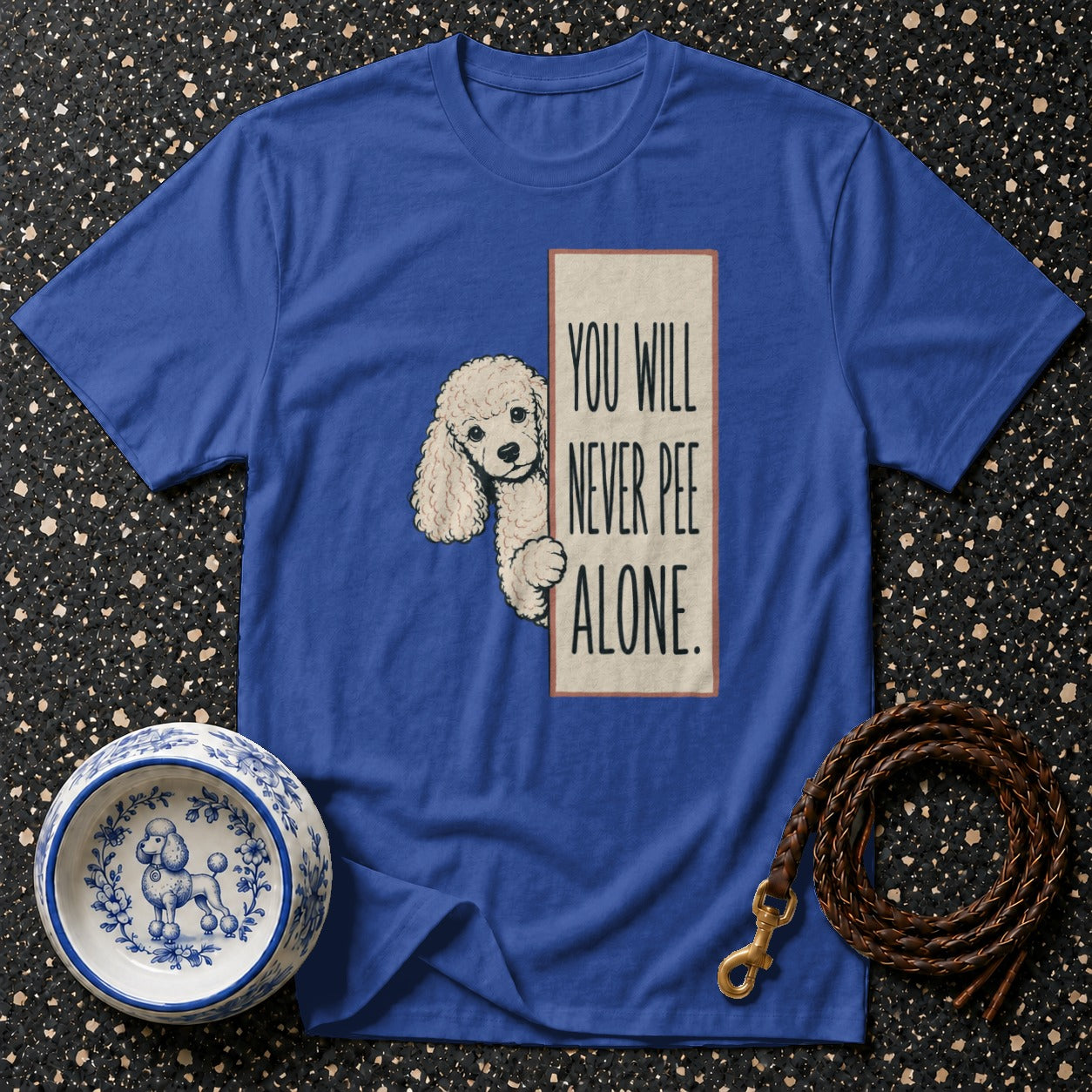 Blue t-shirt with poodle graphic and text "You Will Never Pee Alone."