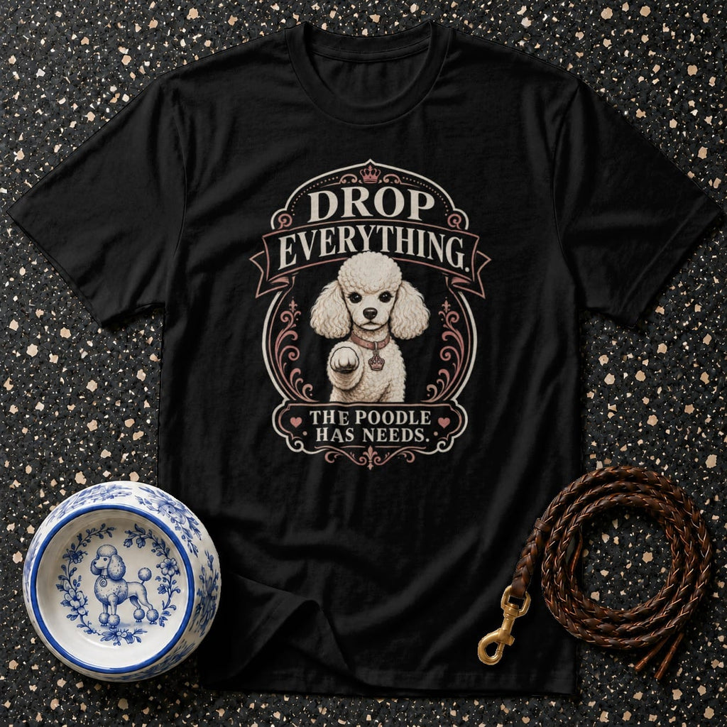 Black t-shirt with "Drop Everything The Poodle Has Needs" graphic.