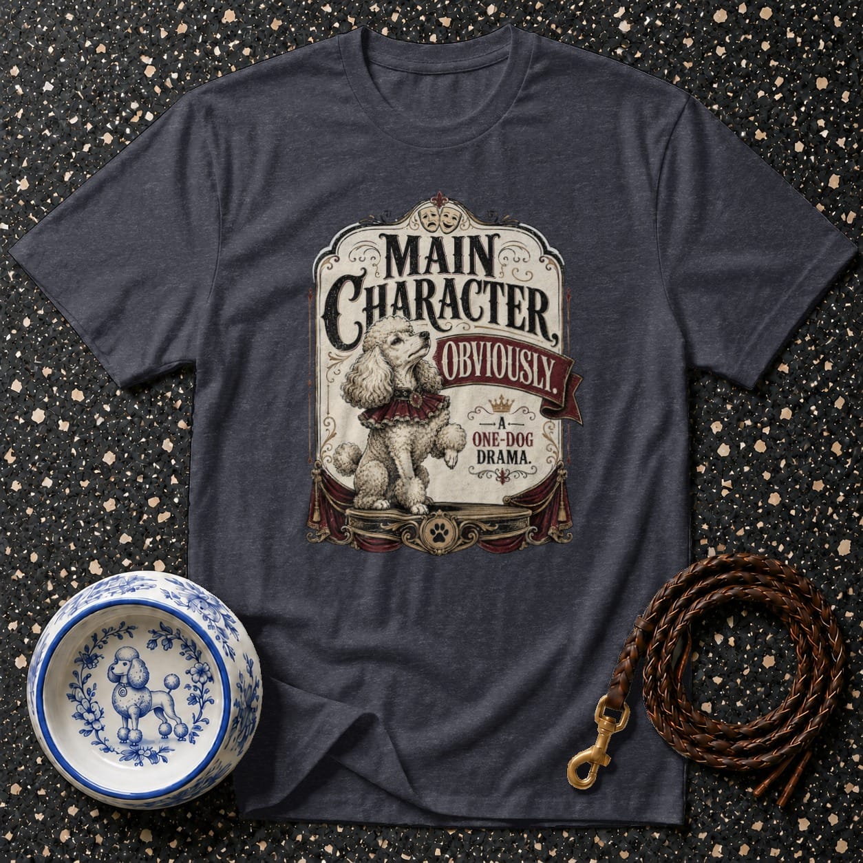 Dark grey t-shirt with a poodle graphic stating "Main Character, Obviously. One-Dog Drama."