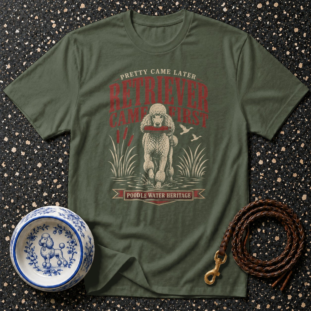 Olive green t-shirt with a poodle retrieving a stick, text reads "POODLE WATER HERITAGE."