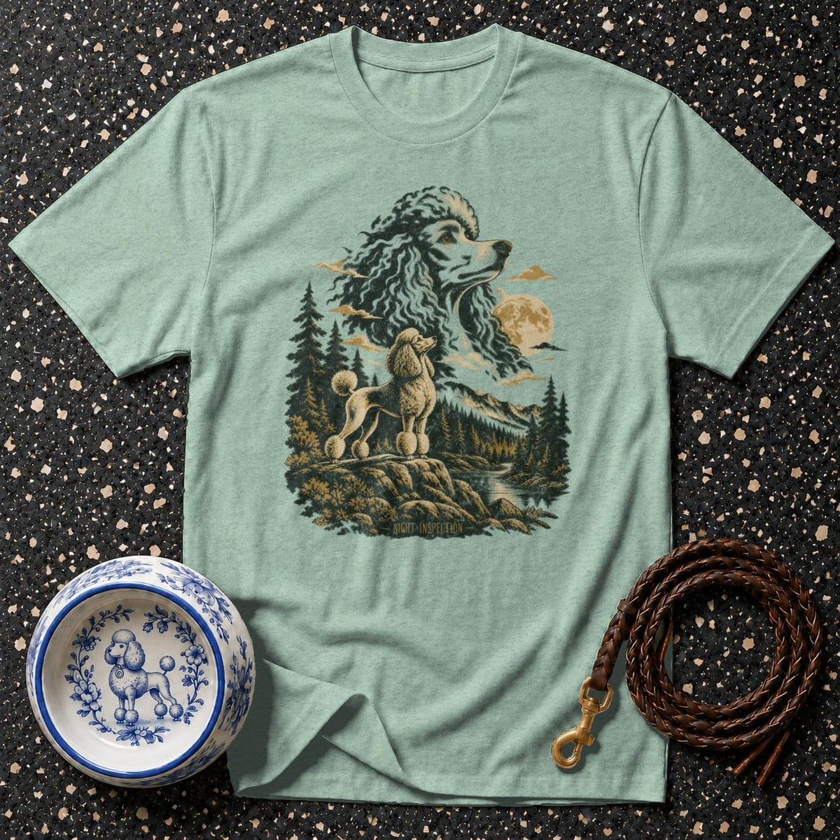 Light mint t-shirt with a graphic of two poodles in a forest landscape.