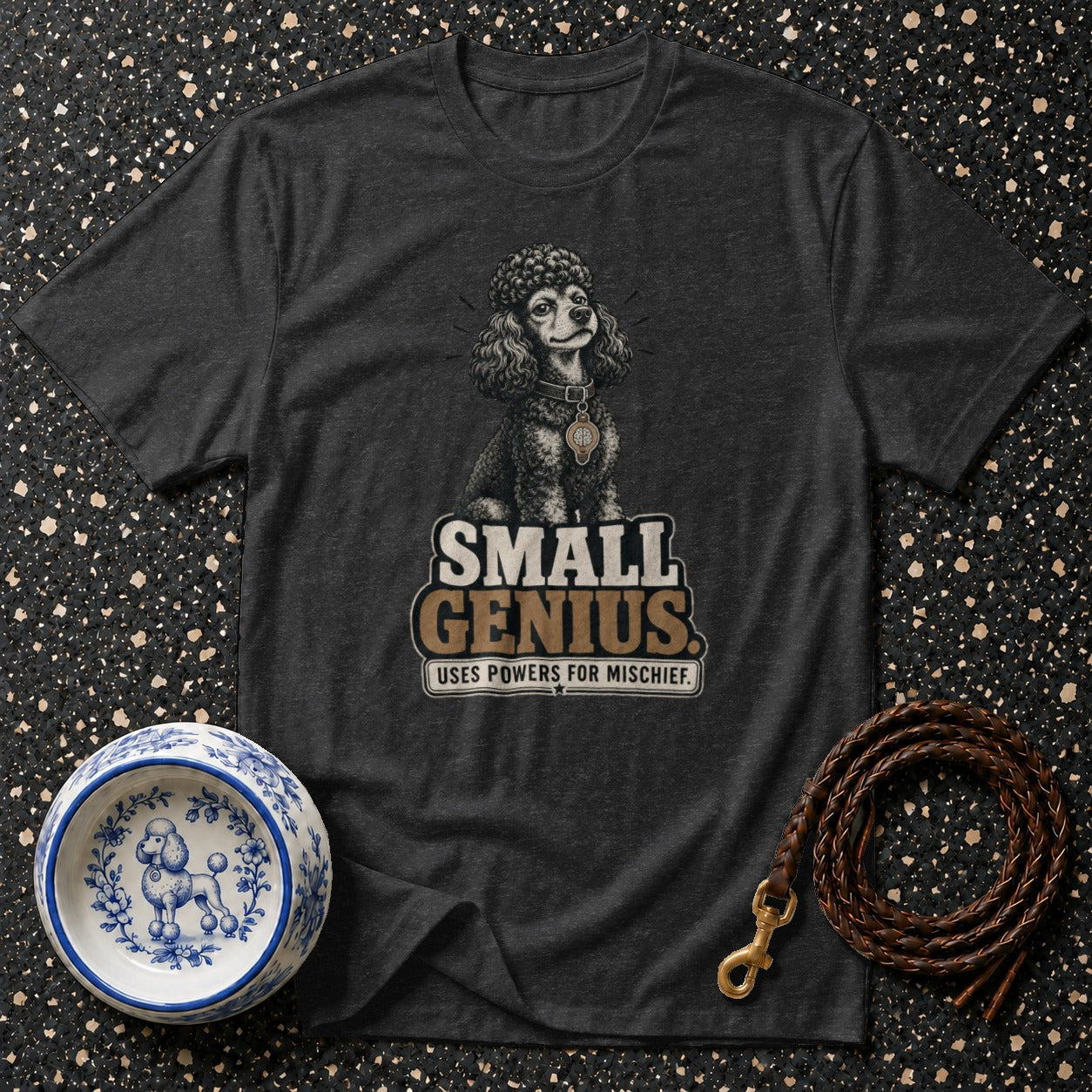 Dark gray t-shirt with poodle graphic and text "SMALL GENIUS. USES POWERS FOR MISCHIEF."