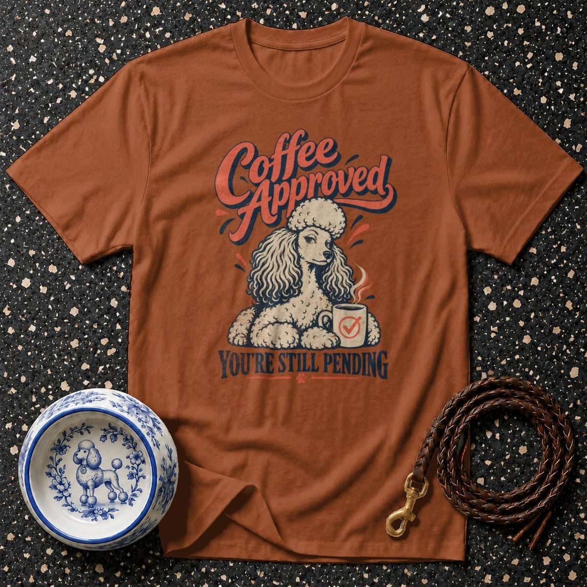 Brown t-shirt with a poodle and coffee cup graphic, text reads "Coffee Approved You're Still Pending".