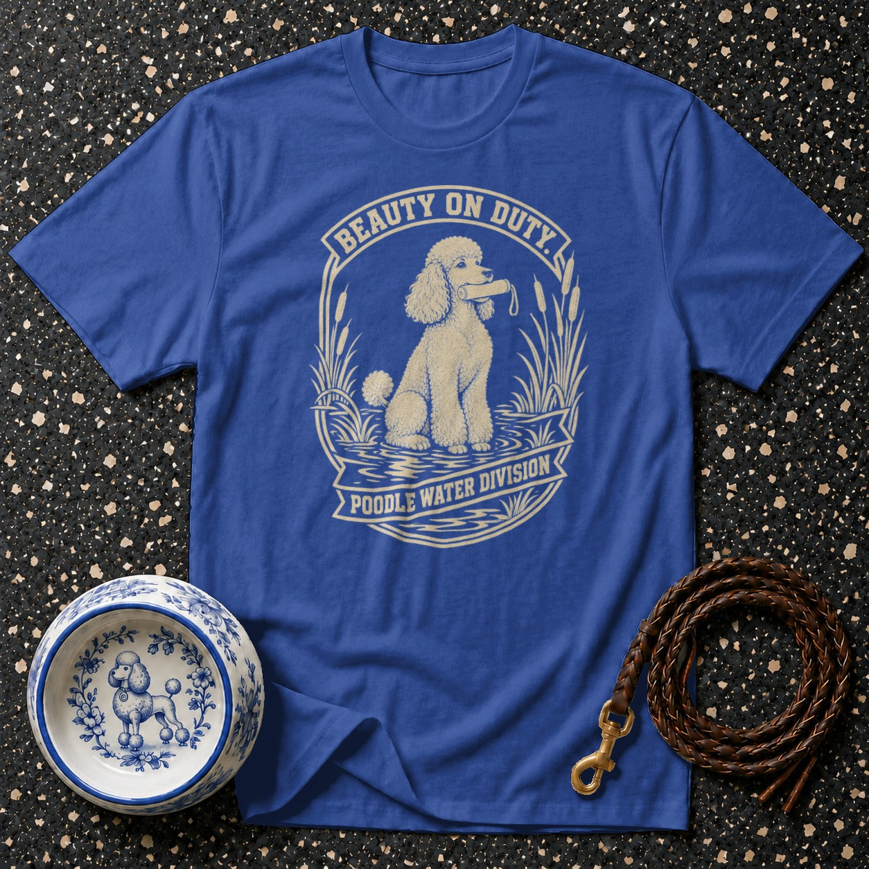 Blue t-shirt with a poodle in water graphic and text "Beauty on Duty Poodle Water Division."