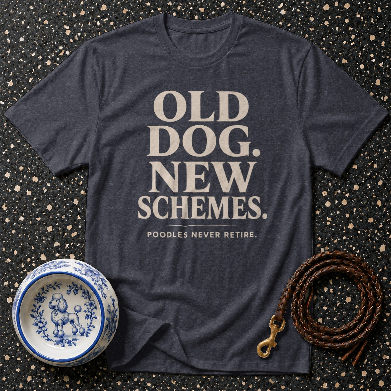 Dark grey t-shirt with "OLD DOG. NEW SCHEMES. POODLES NEVER RETIRE." text.
