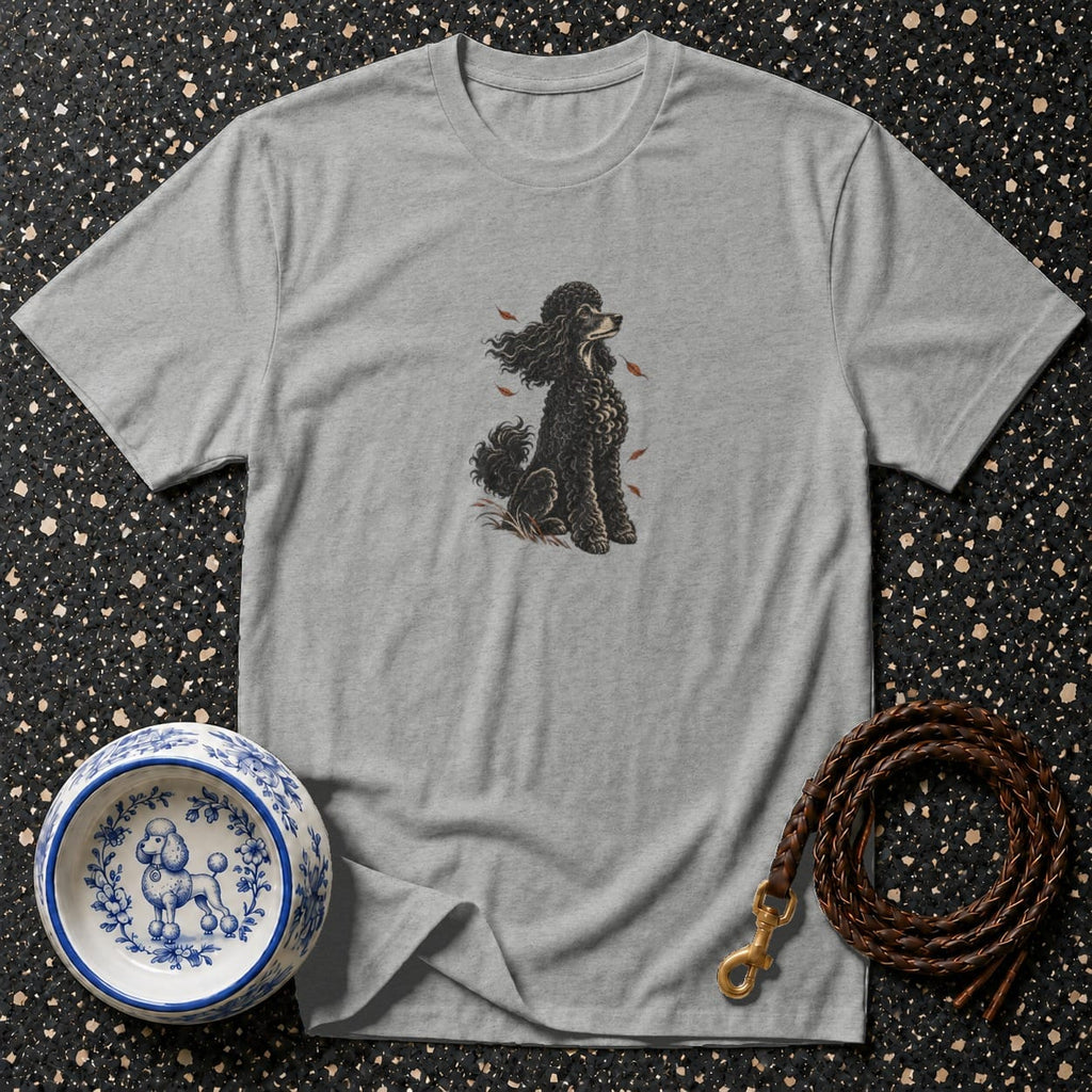 Grey t-shirt with black poodle illustration, decorative dog bowl, and leather leash.