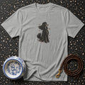 Grey t-shirt with black poodle illustration, decorative dog bowl, and leather leash.