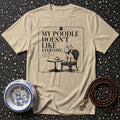 Tan t-shirt with "My Poodle Doesn't Like Everyone" text and poodle graphic.