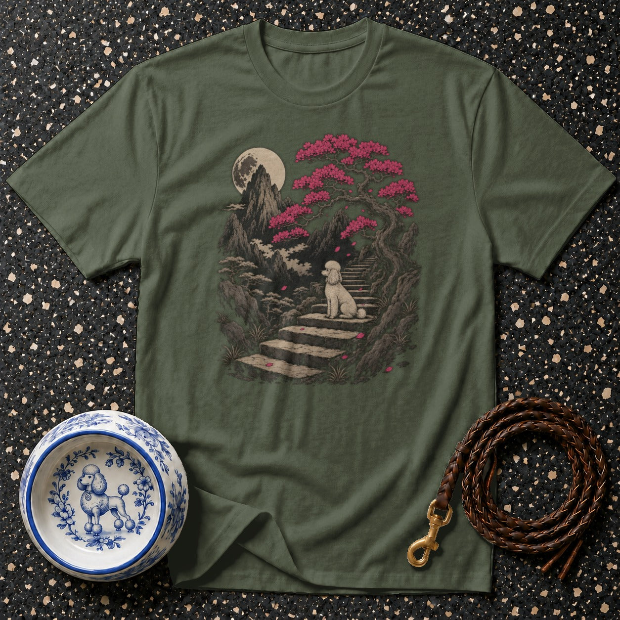 Green t-shirt featuring a poodle sitting on stairs under a cherry blossom tree.