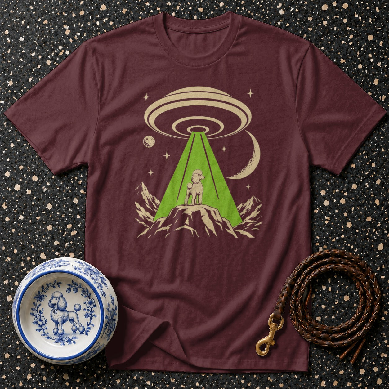 Maroon t-shirt with poodle on mountain under a UFO beam.