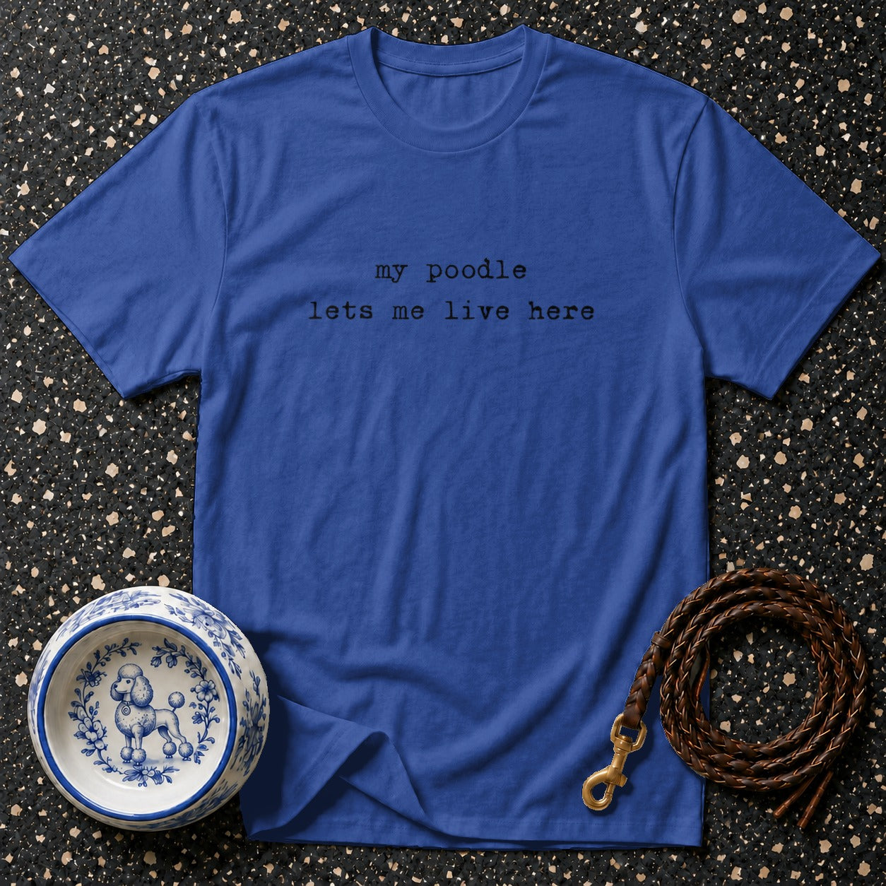 Royal blue t-shirt with "my poodle lets me live here" text.