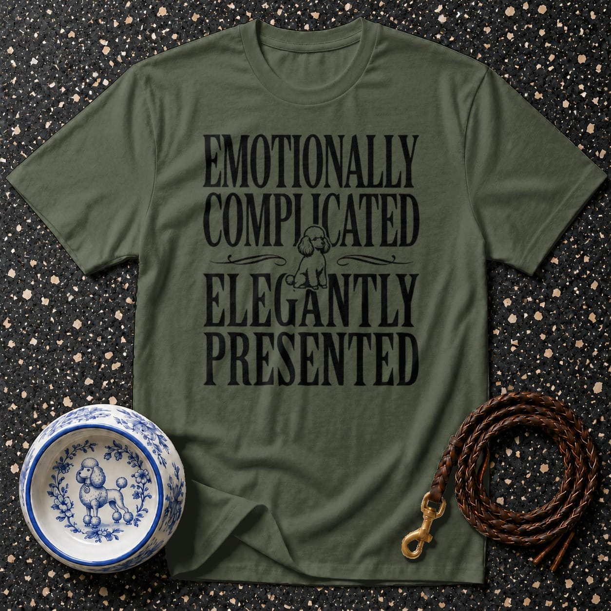 Green t-shirt with "Emotionally Complicated Elegantly Presented" text and poodle graphic.