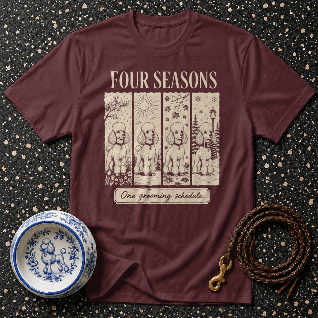 Maroon t-shirt with "Four Seasons" and poodles in different seasons, and "One grooming schedule."