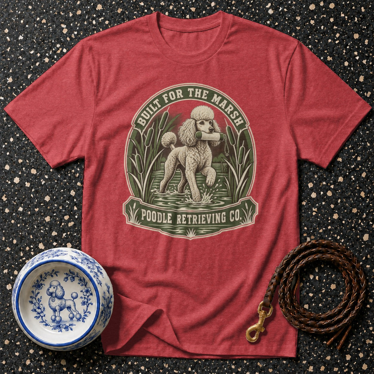 Red t-shirt with "Built for the Marsh Poodle Retrieving Co." graphic of a poodle.