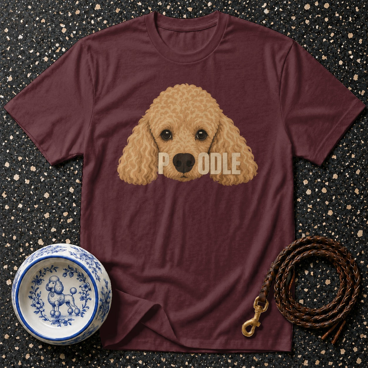Maroon t-shirt with a stylized poodle face graphic and the word "POODLE".