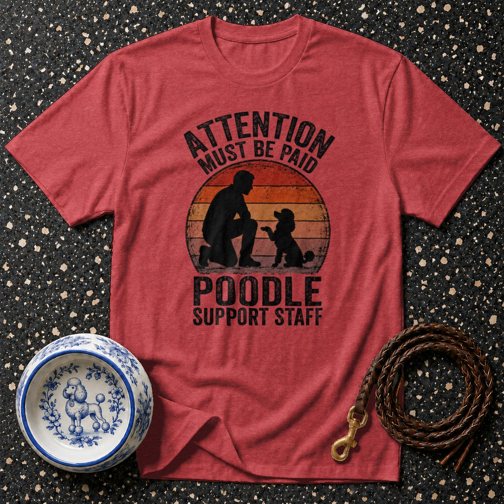 Red t-shirt with "ATTENTION MUST BE PAID POODLE SUPPORT STAFF" graphic.