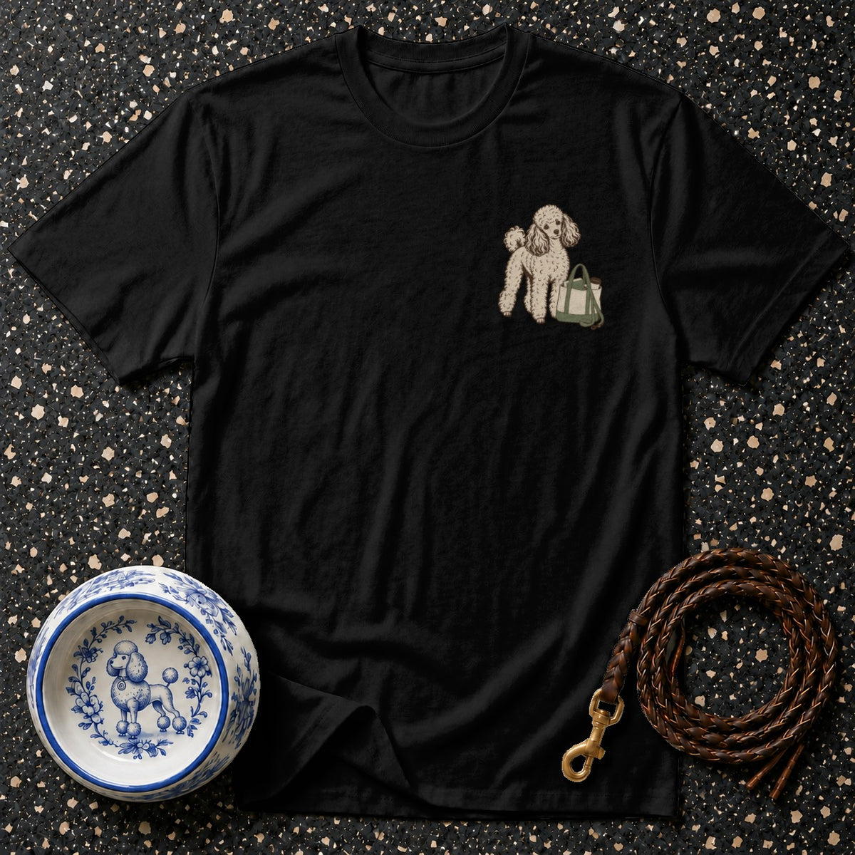 Black t-shirt with embroidered poodle and tote bag design.