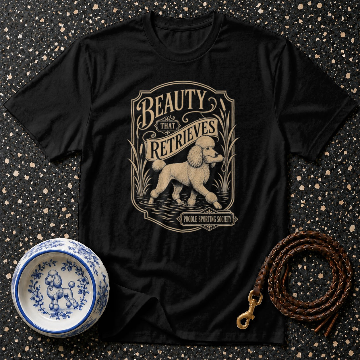 Black t-shirt with vintage poodle retrieving artwork and "Beauty That Retrieves" text.