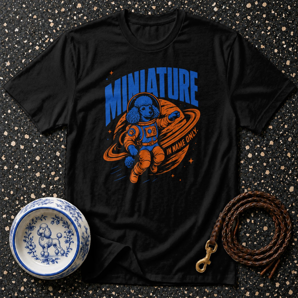 Black t-shirt with blue and orange graphic of a poodle in an astronaut suit in space.