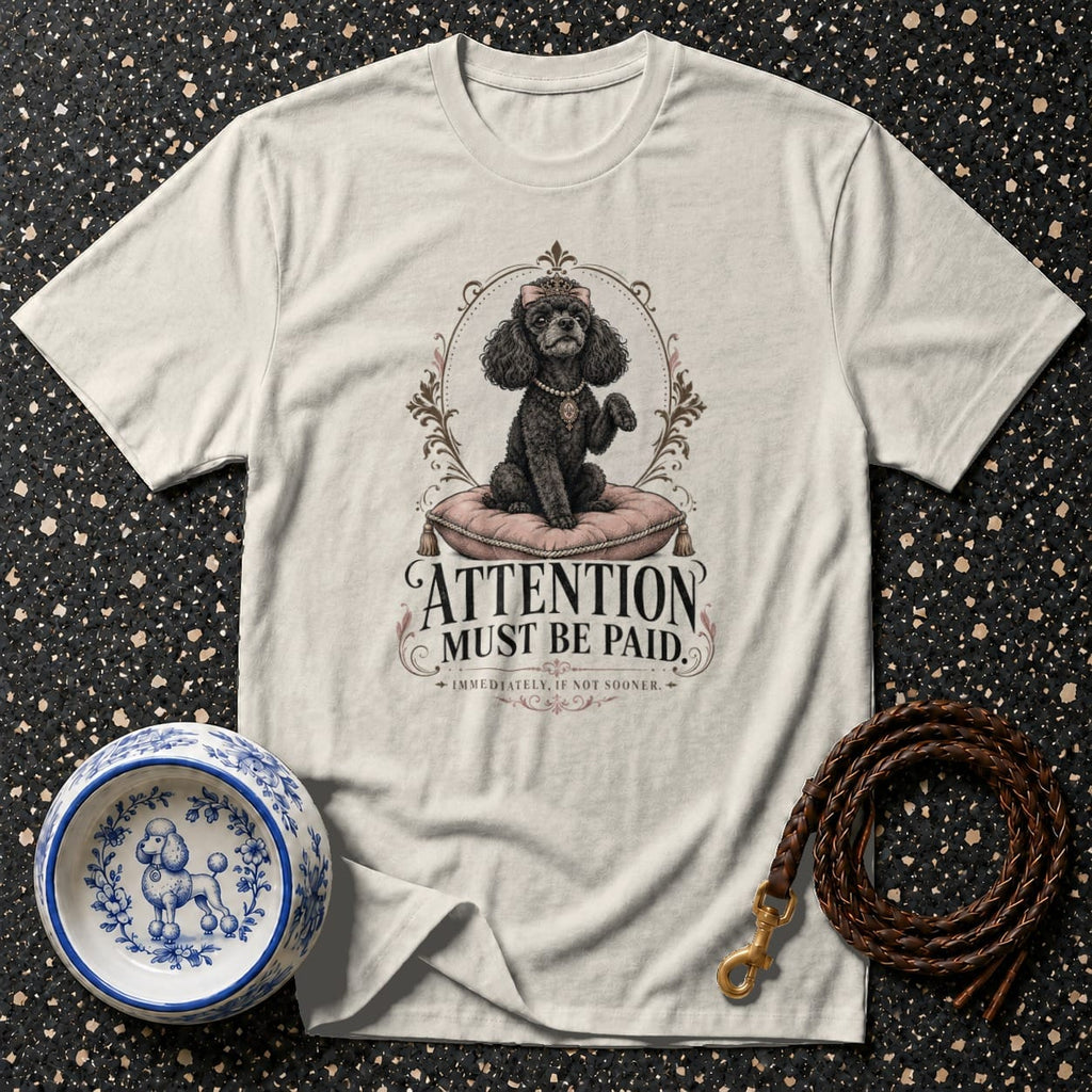 T-shirt with regal poodle graphic and "Attention Must Be Paid" text.