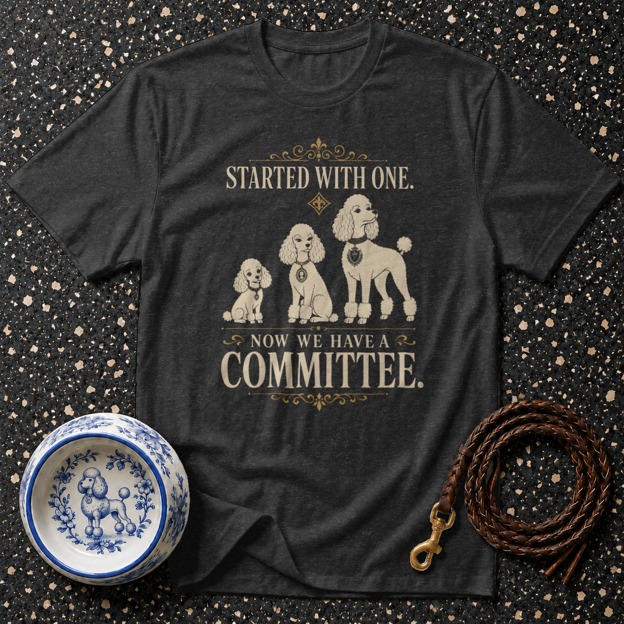 Dark t-shirt with three poodles and the text "STARTED WITH ONE. NOW WE HAVE A COMMITTEE."