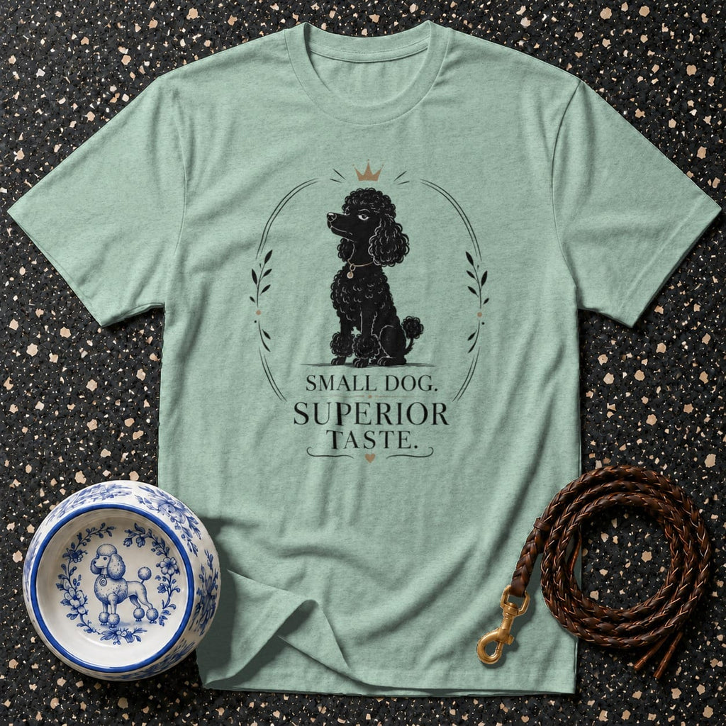 Light green t-shirt with a black poodle design and text "Small Dog. Superior Taste."