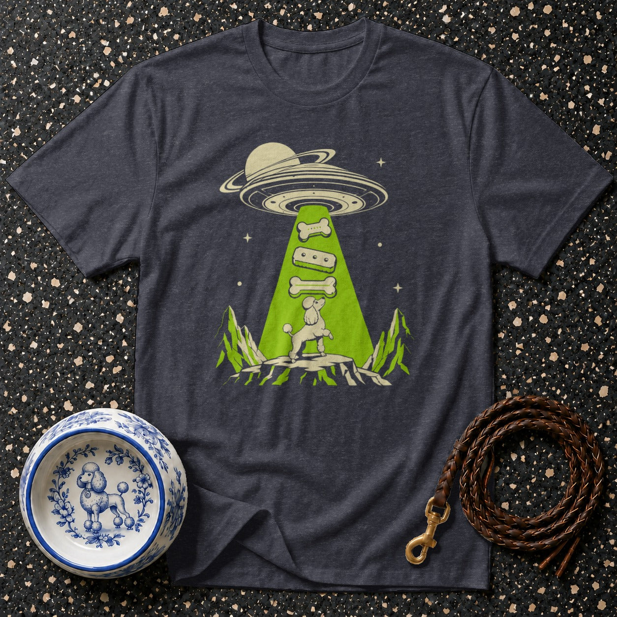 T-shirt with poodle abducted by a UFO beam, carrying bones.