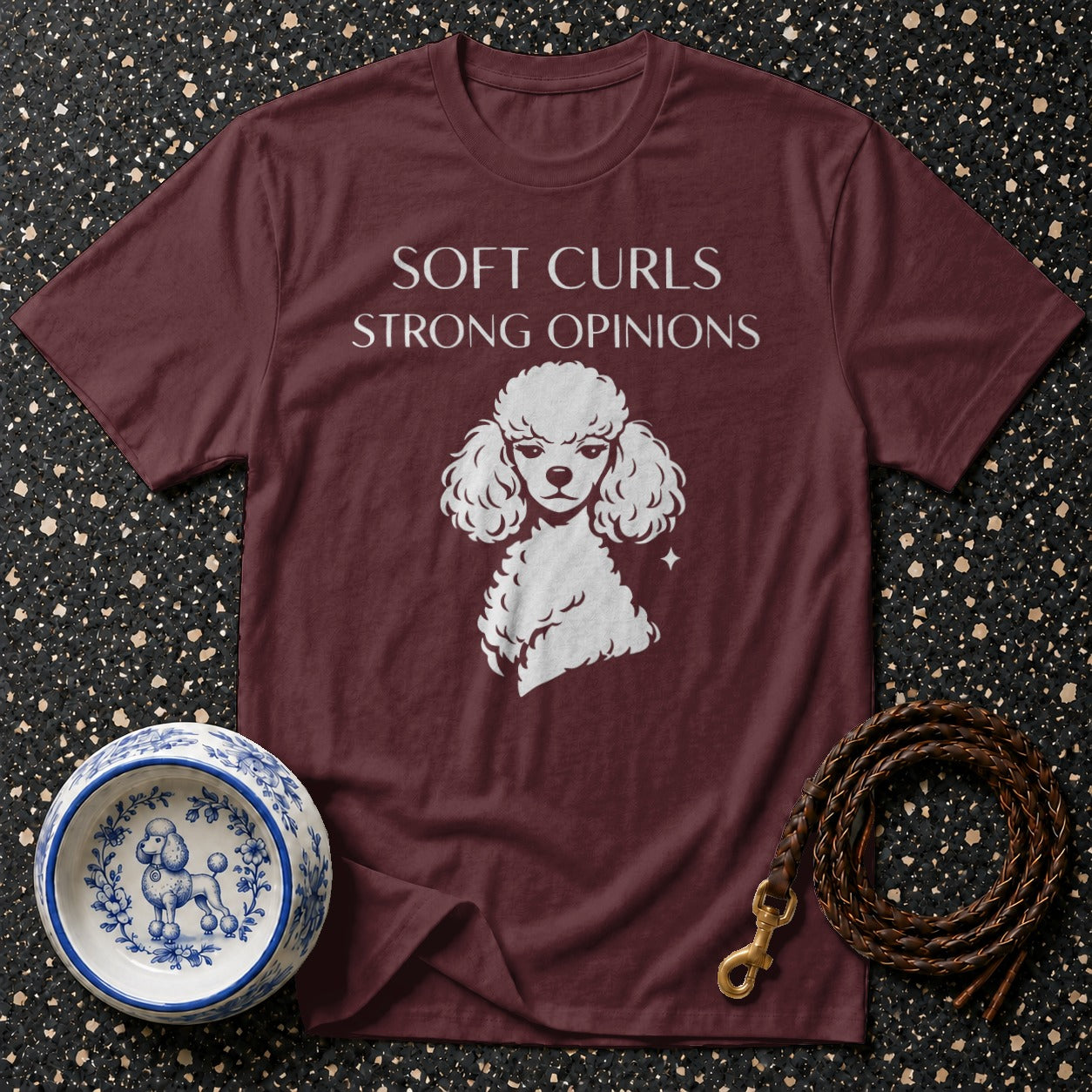 Maroon t-shirt with white poodle graphic and "Soft Curls Strong Opinions" text.