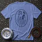 Blue t-shirt with oval graphic of poodle golfer and text "EMOTIONAL SUPPORT CADDIE".