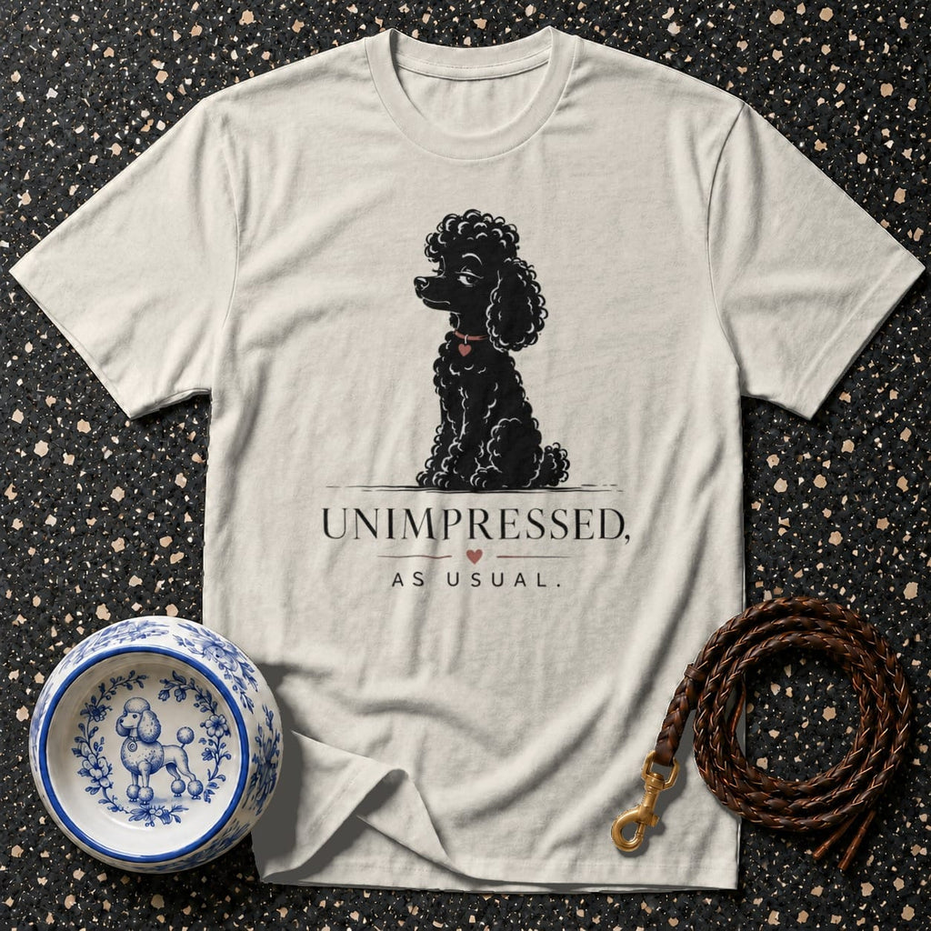 T-shirt with black poodle art and "UNIMPRESSED, AS USUAL." text.