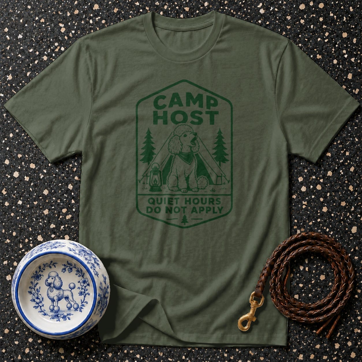 Green t-shirt with a camping scene and text "CAMP HOST QUIET HOURS DO NOT APPLY".